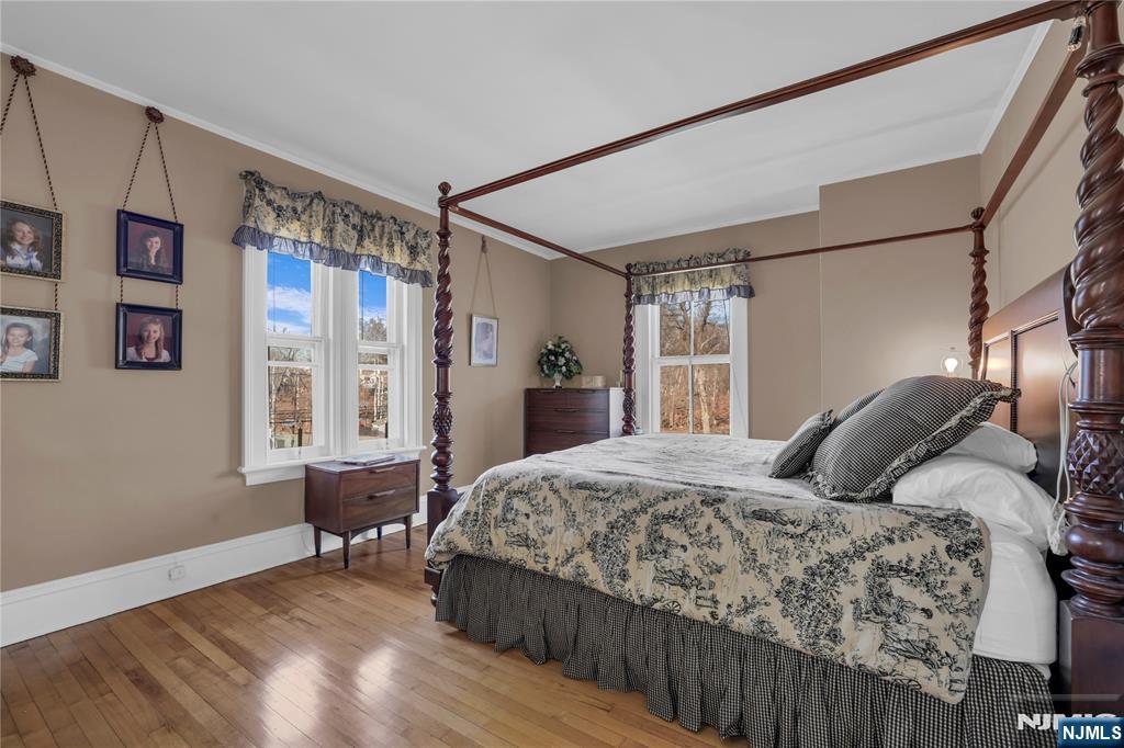 265 Little Falls Road Cedar Grove, NJ 07009 - Photo 31 of 44 a bedroom with a large bed and a window