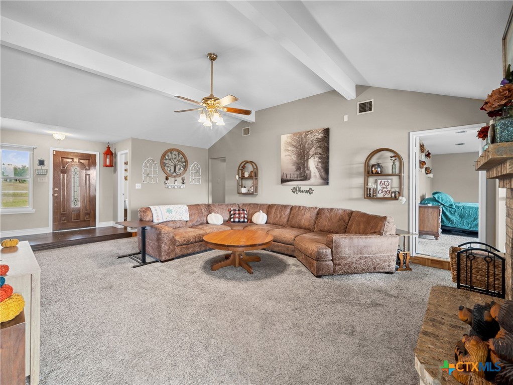 782 Santa Clara Loop Marion, TX 78124 - Photo 37 of 48 a living room with furniture a chandelier and a flat screen tv