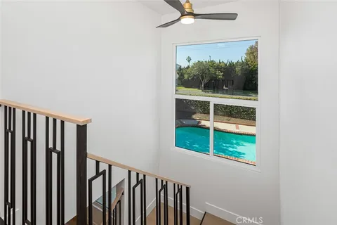 a bedroom with a large bed and a flat screen tv