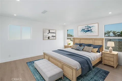 a bathroom with a double vanity sink a mirror and a bathtub