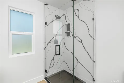 a view of hallway with wooden floor