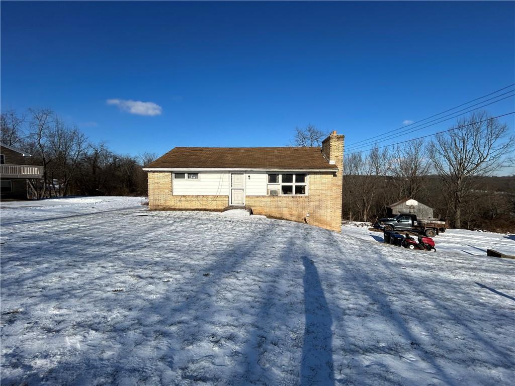 1512 Spring Run Road Extension Coraopolis, PA 15108 - Photo 1 of 29 a view of a house with truck parked on the road