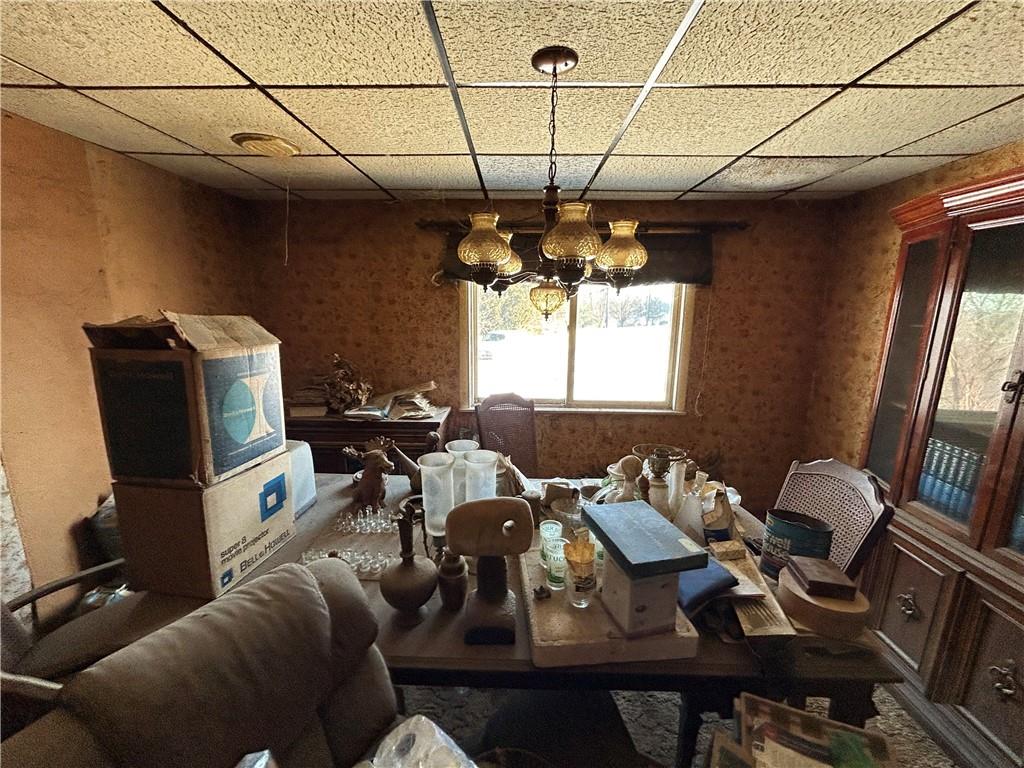 1512 Spring Run Road Extension Coraopolis, PA 15108 - Photo 3 of 29 a view of a dining room with furniture a chandelier and wooden floor