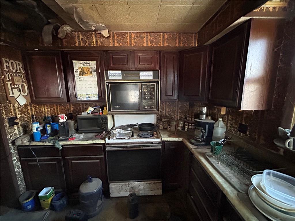1512 Spring Run Road Extension Coraopolis, PA 15108 - Photo 8 of 29 a kitchen with a sink appliances and cabinets
