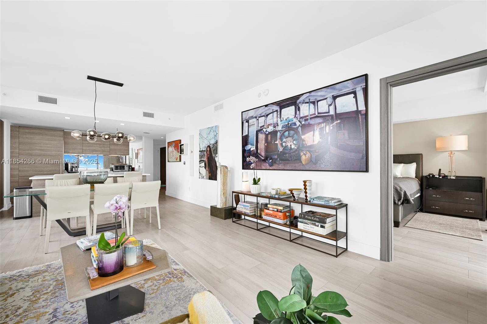 650 Northeast 32nd Street, Unit 2201 Miami, FL 33137 - Photo 11 of 35 a living room with furniture and a flat screen tv