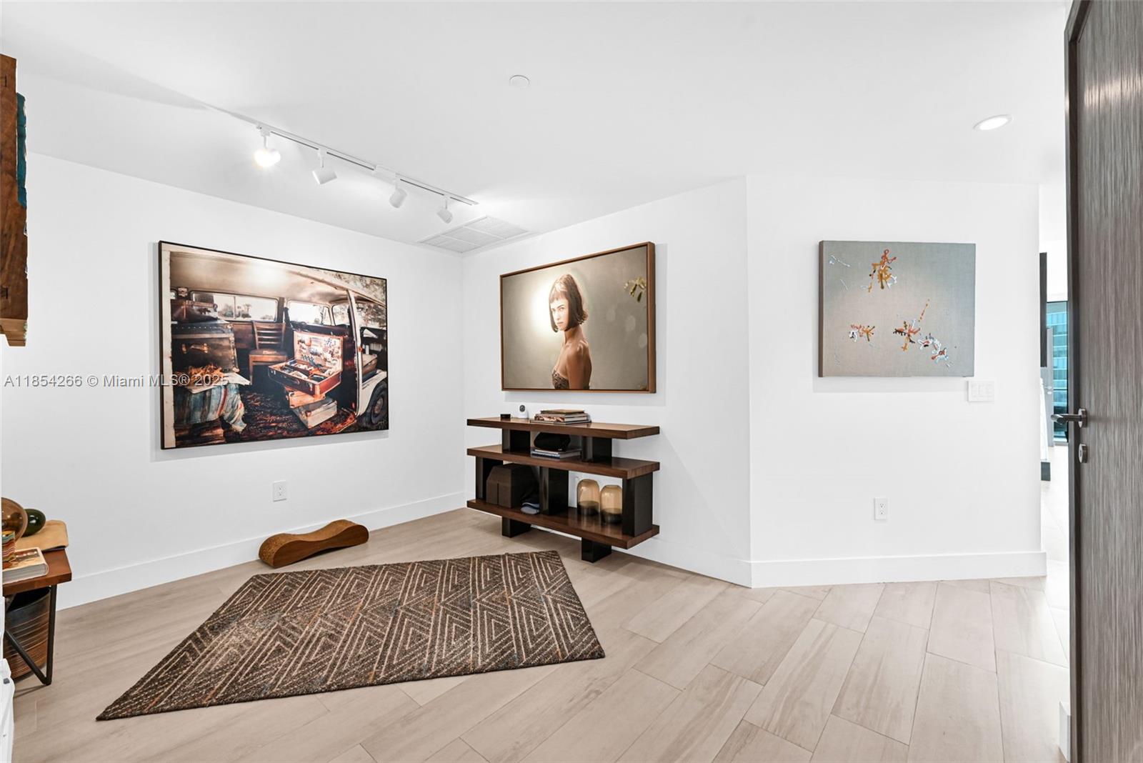 650 Northeast 32nd Street, Unit 2201 Miami, FL 33137 - Photo 12 of 35 a living room with furniture and wooden floor