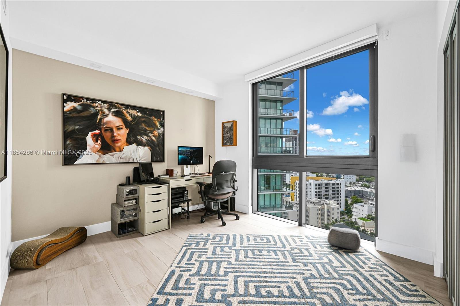 650 Northeast 32nd Street, Unit 2201 Miami, FL 33137 - Photo 20 of 35 a bedroom with furniture and a window