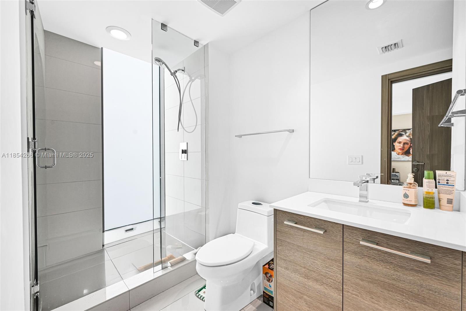 650 Northeast 32nd Street, Unit 2201 Miami, FL 33137 - Photo 22 of 35 a bathroom with a sink toilet and shower