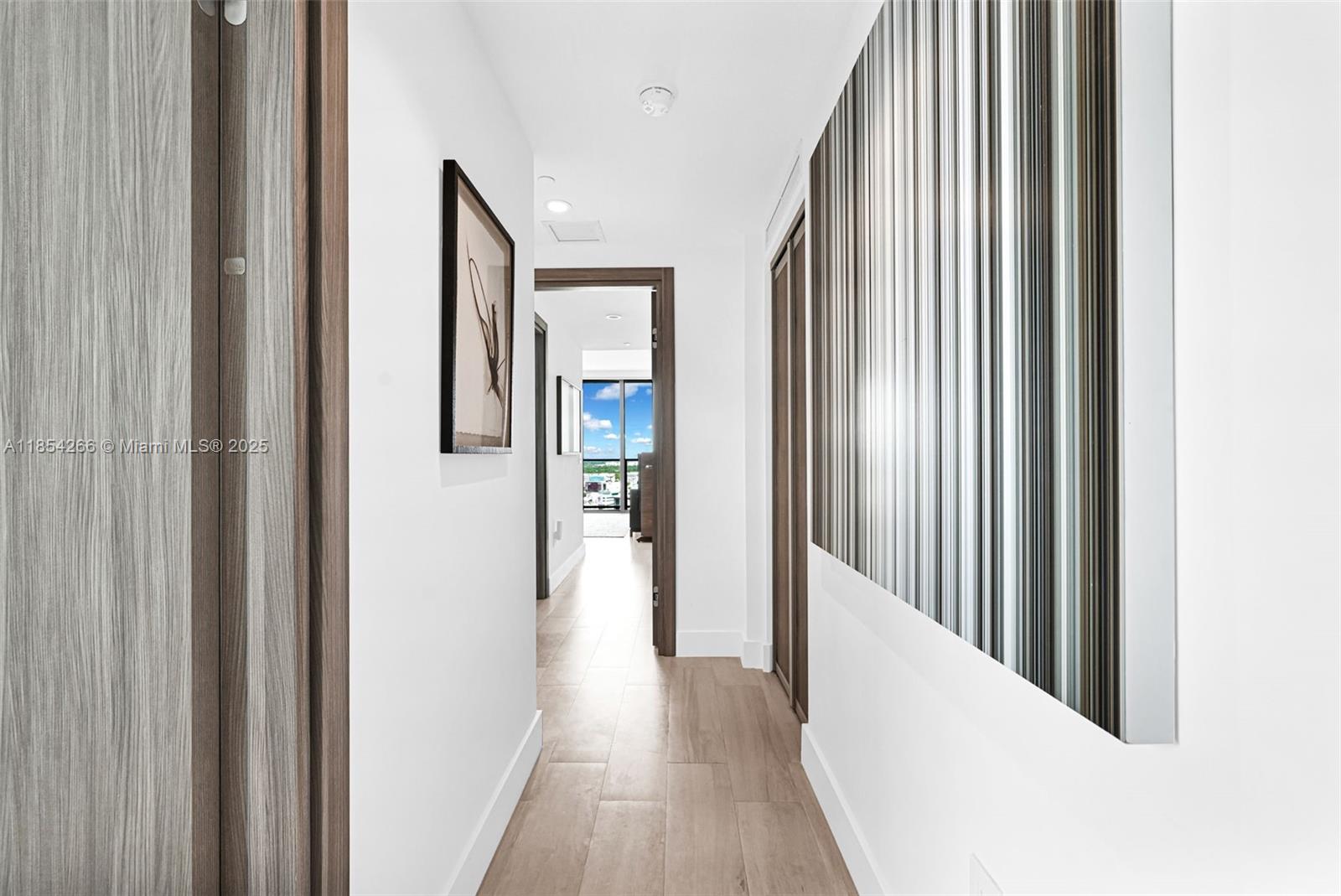 650 Northeast 32nd Street, Unit 2201 Miami, FL 33137 - Photo 23 of 35 a view of a hallway with wooden floor