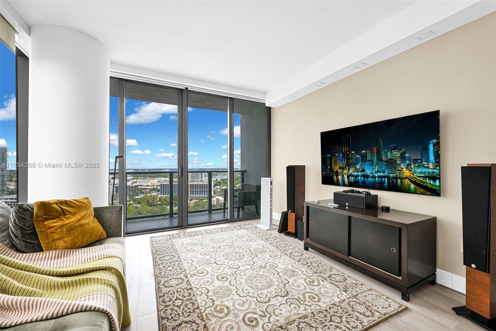 650 Northeast 32nd Street, Unit 2201 Miami, FL 33137 - Photo 25 of 35 a living room with furniture and a flat screen tv