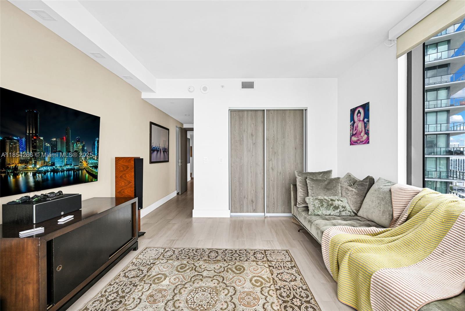 650 Northeast 32nd Street, Unit 2201 Miami, FL 33137 - Photo 26 of 35 a living room with furniture and a rug