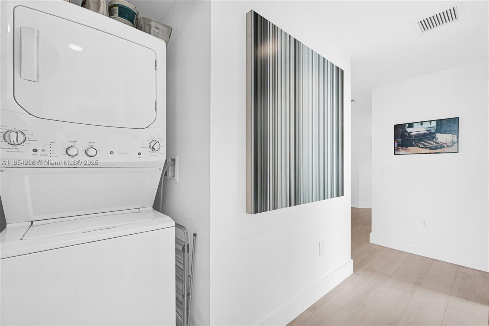 650 Northeast 32nd Street, Unit 2201 Miami, FL 33137 - Photo 28 of 35 a view of a utility room with dryer and washer