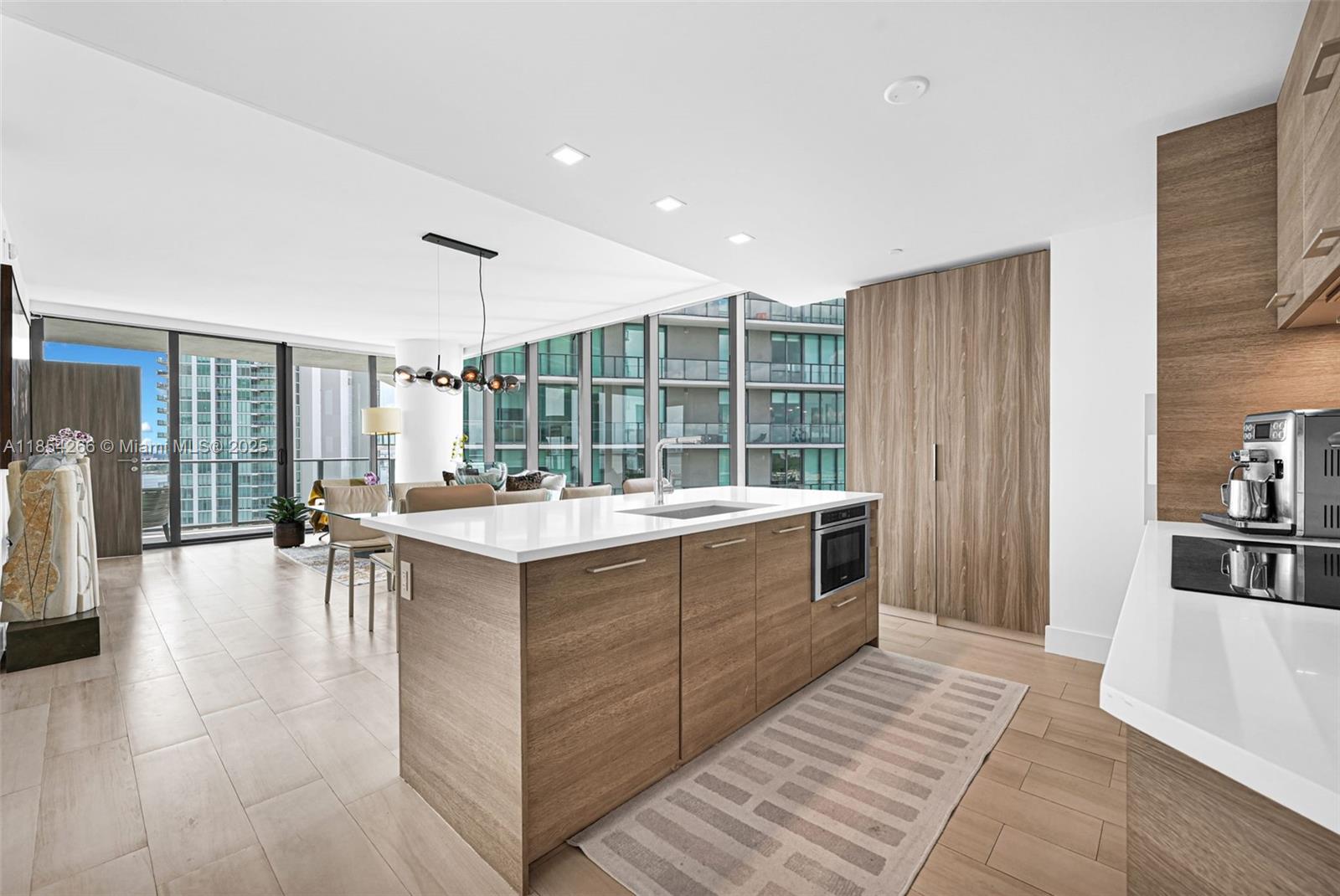 650 Northeast 32nd Street, Unit 2201 Miami, FL 33137 - Photo 3 of 35 a large white kitchen with a large window