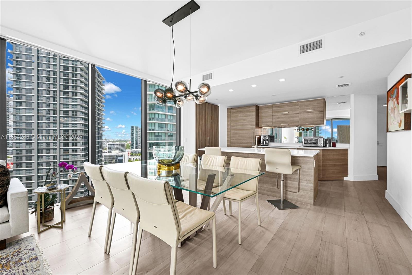 650 Northeast 32nd Street, Unit 2201 Miami, FL 33137 - Photo 5 of 35 a view of a dining room with furniture window and outside view