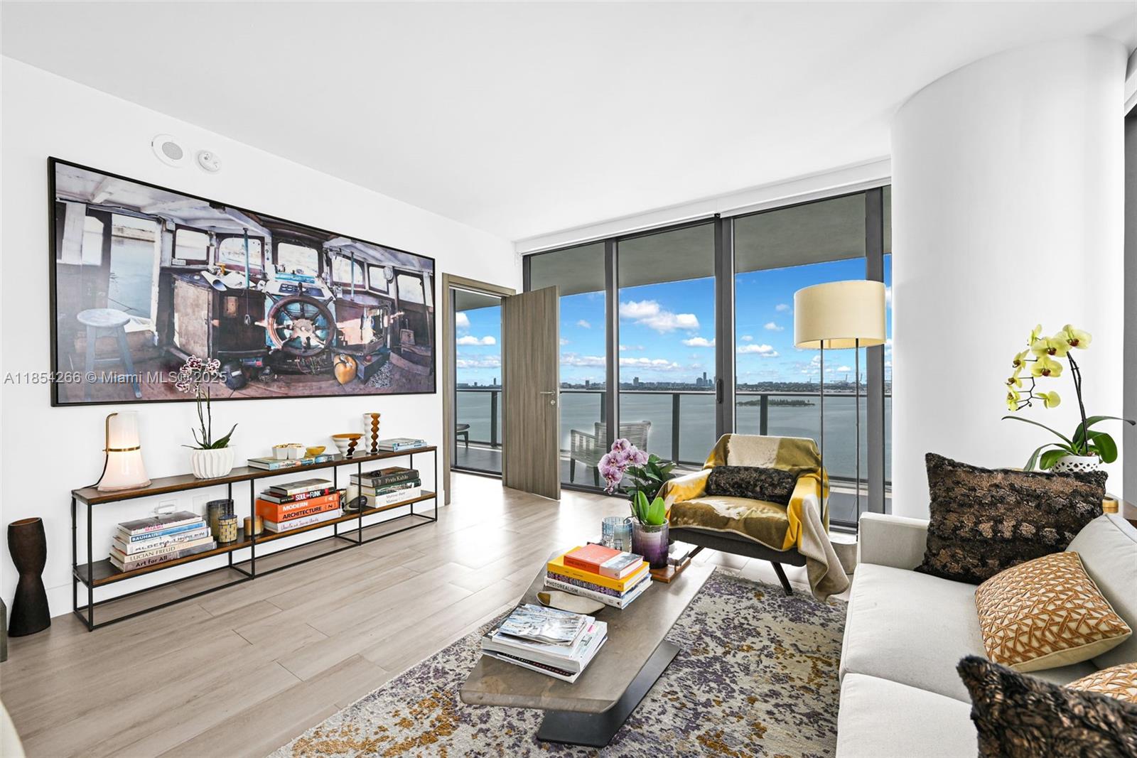 650 Northeast 32nd Street, Unit 2201 Miami, FL 33137 - Photo 9 of 35 a living room with furniture and a floor to ceiling window