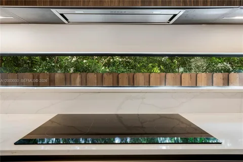 a view of table and chair with an umbrella