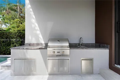 a white stove top oven sitting inside of a kitchen