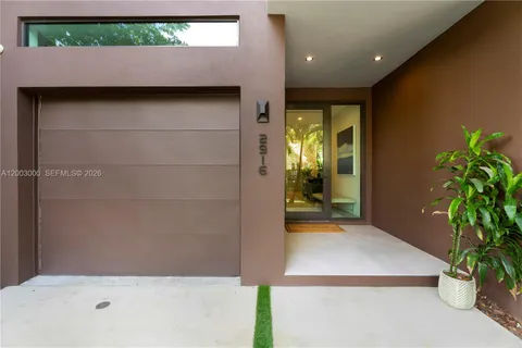a bathroom with a potted plant