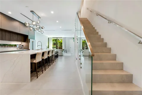 a view of a kitchen with furniture and a kitchen