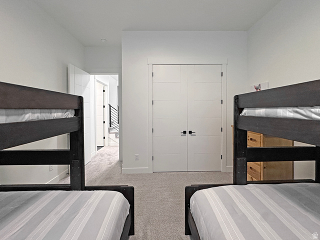 851 Grandview Drive Morgan, UT 84050 - Photo 46 of 68 Carpeted room featuring dual white paneled doors with contemporary black hardware