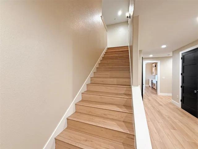 a view of a big room with closet and windows