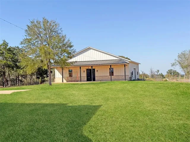 a view of an ocean with a floor to ceiling window and stairs