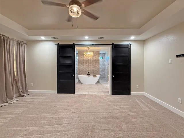 a view of an empty room with a bathroom