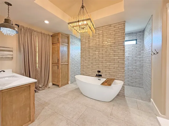 a bathroom with a sink a mirror and shower