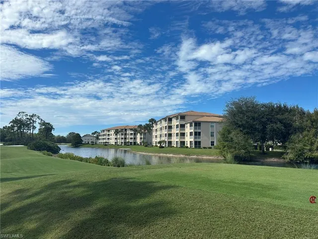 a view of a big house with a big yard
