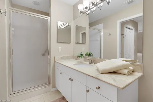 a bedroom with two beds and a window