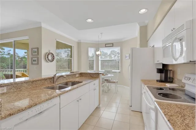 a kitchen with a sink stove and refrigerator