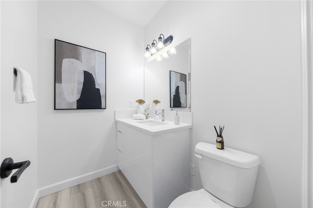 1359 Point Loma Place Walnut, CA 91789 - Photo 29 of 75 a bathroom with a toilet sink and mirror