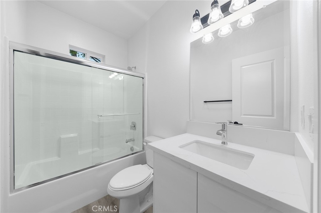 1359 Point Loma Place Walnut, CA 91789 - Photo 31 of 75 a bathroom with a sink toilet a mirror and shower