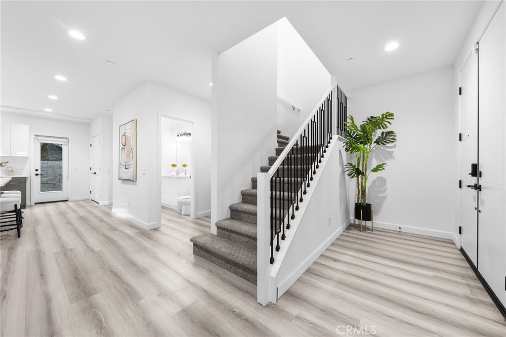 1359 Point Loma Place Walnut, CA 91789 - Photo 32 of 75 a view of a hallway with wooden floor and staircase