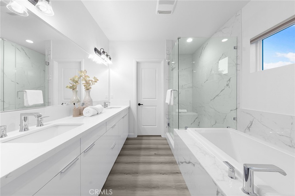 1359 Point Loma Place Walnut, CA 91789 - Photo 44 of 75 a spacious bathroom with a double vanity sink and mirror with shower