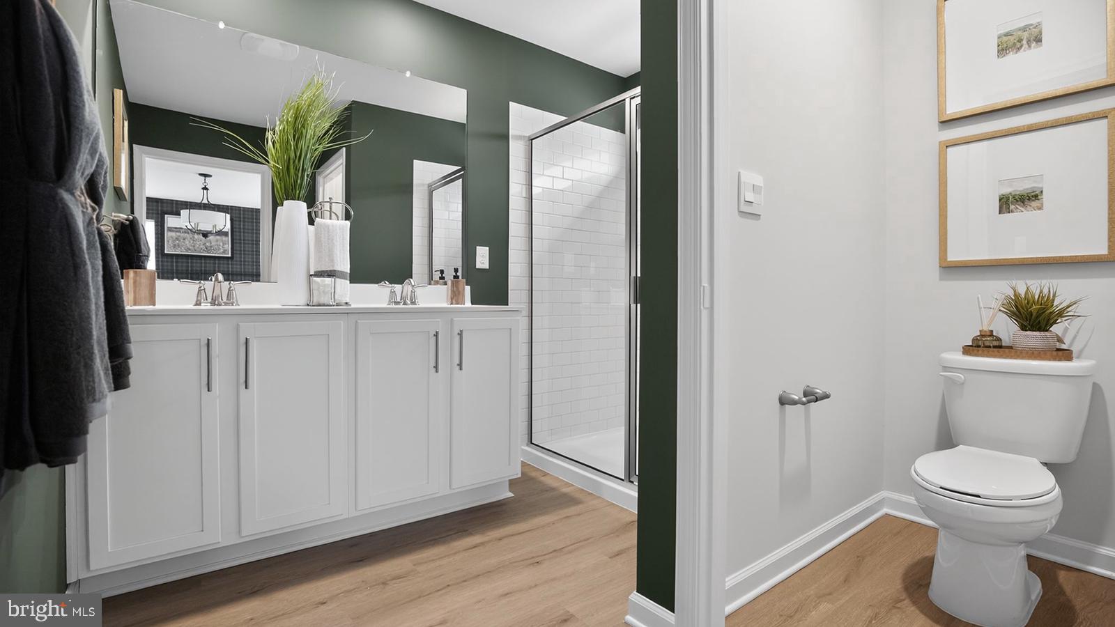6 Haddon Avenue Gibbsboro, NJ 08026 - Photo 11 of 39 a bathroom with a toilet a sink and mirror