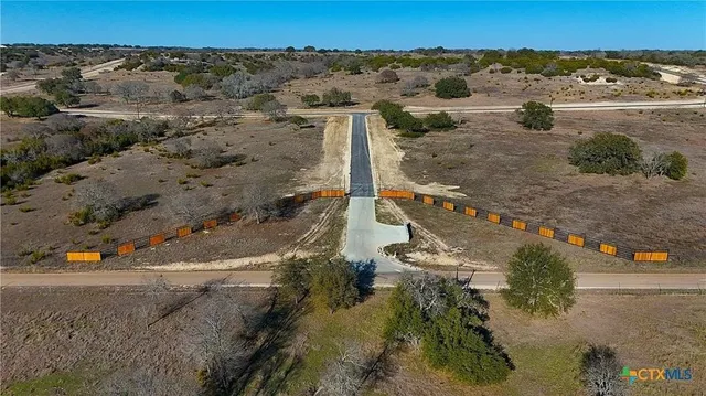 an aerial view of city and ocean