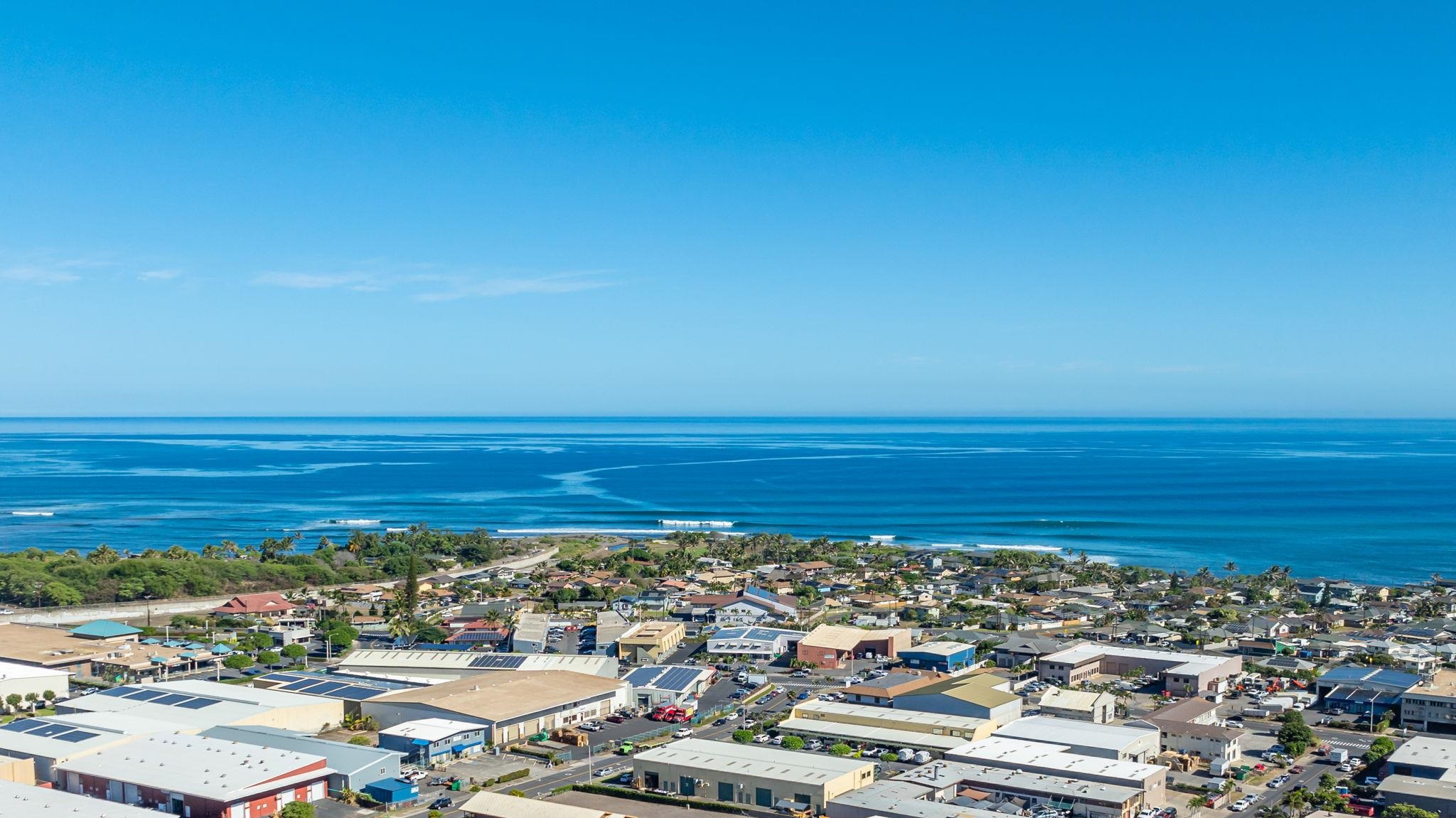 an aerial view of a ocean and city