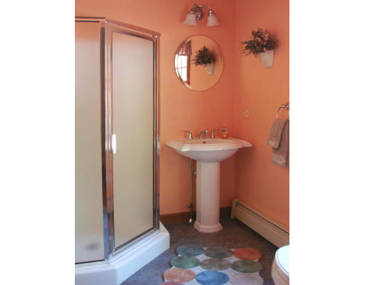 12 River Road Merrimac, MA 01860 - Photo 21 of 28 a bathroom with a sink mirror and toilet