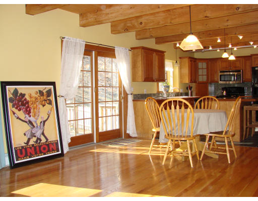 12 River Road Merrimac, MA 01860 - Photo 6 of 28 a view of a dining room with furniture a chandelier and wooden floor