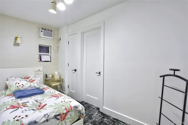 a bathroom with a bathtub shower sink vanity and toilet