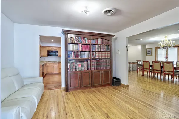 a kitchen with granite countertop stainless steel appliances a refrigerator a sink and a stove top oven