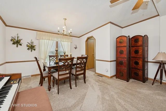 a dining room with furniture and window
