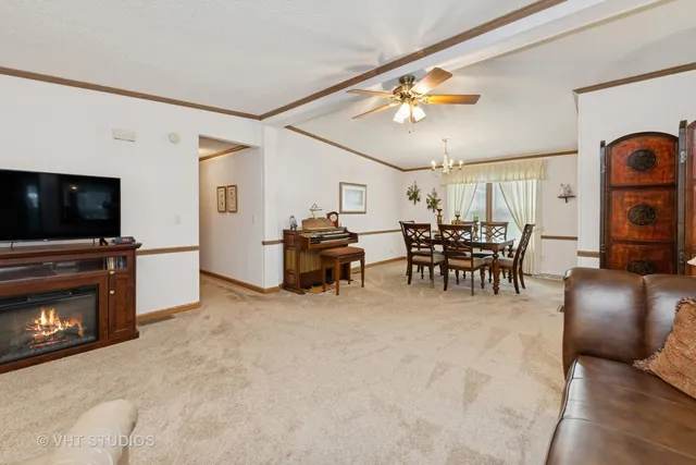 a view of a livingroom with furniture and a flat screen tv