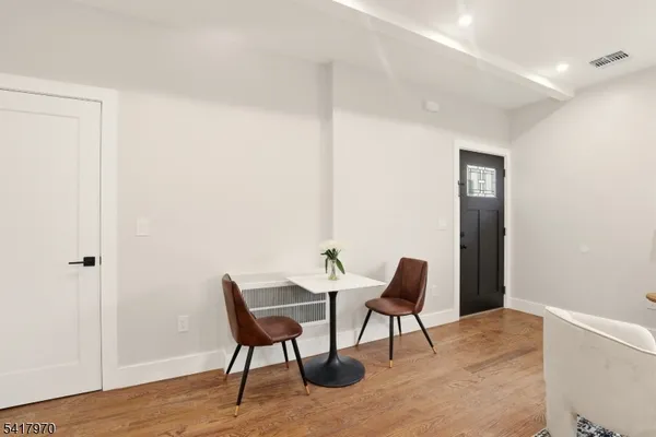 a workspace room with furniture and wooden floor