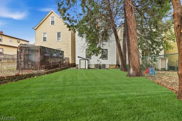a view of a backyard of the house
