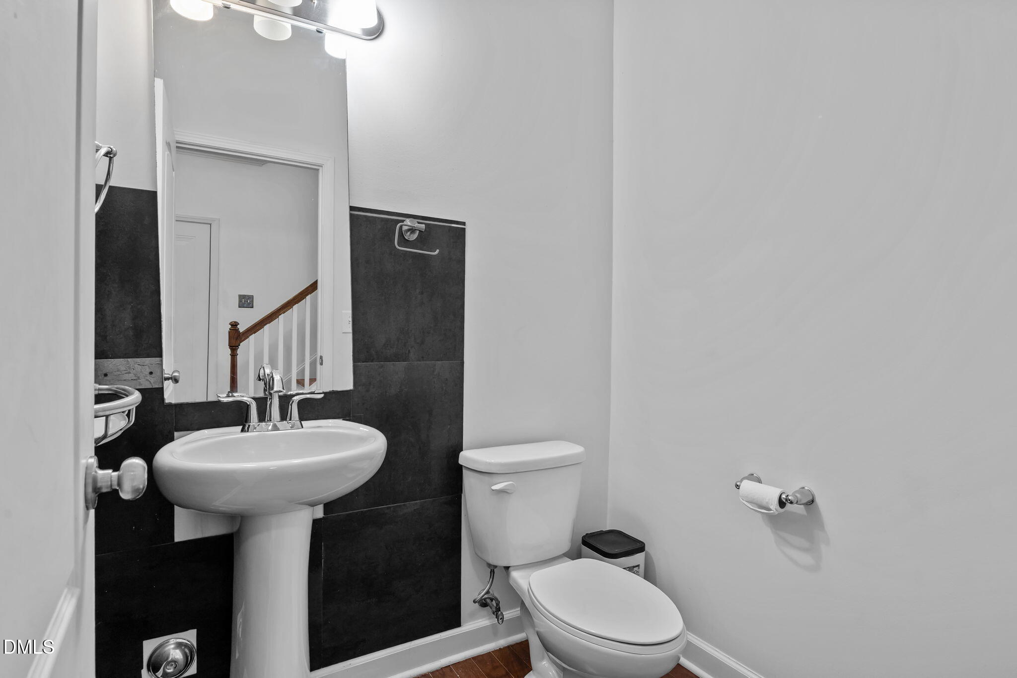 3409 South Beaver Lane Raleigh, NC 27604 - Photo 15 of 31 a bathroom with a sink toilet and a mirror