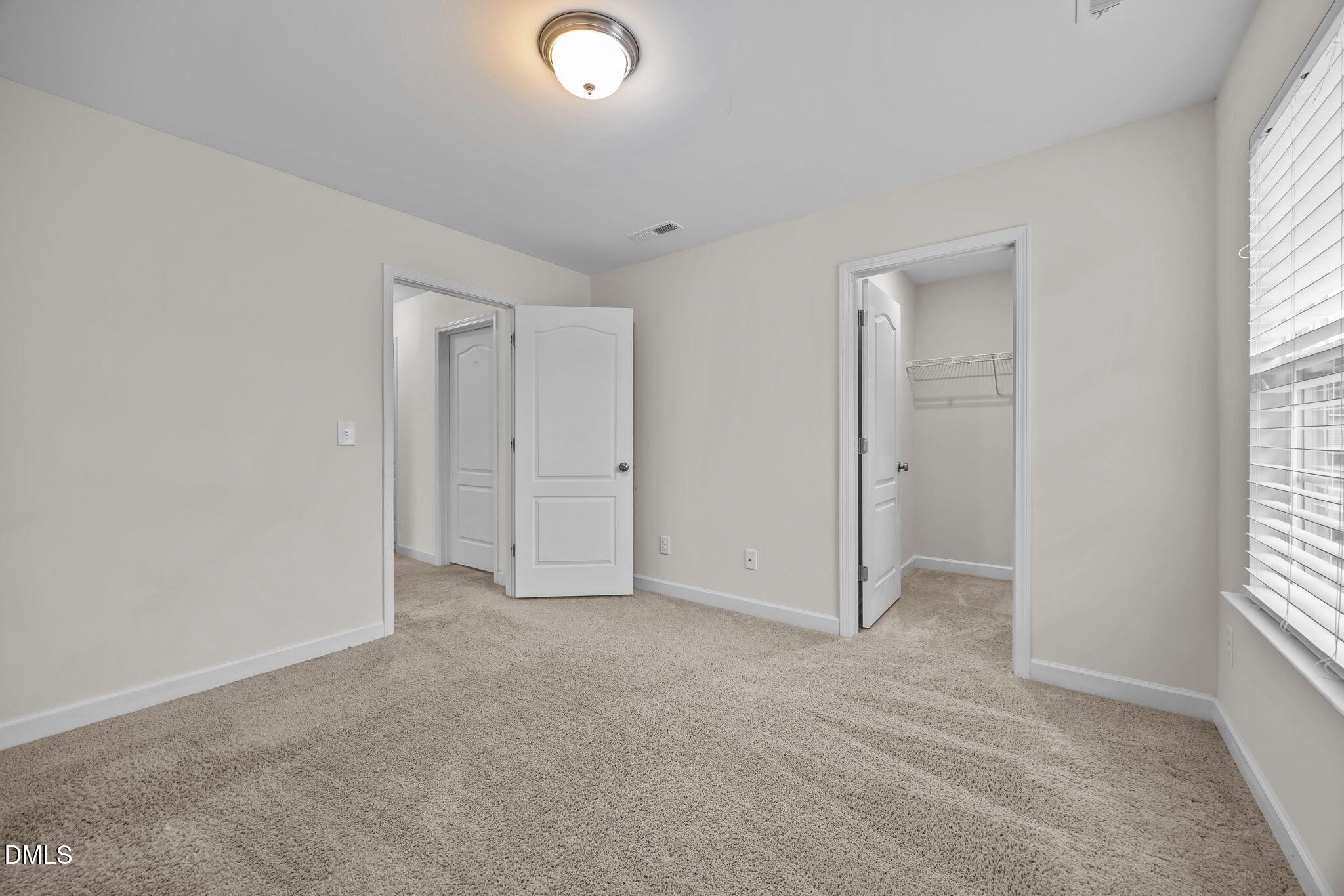 3409 South Beaver Lane Raleigh, NC 27604 - Photo 21 of 31 an empty room with windows and closet