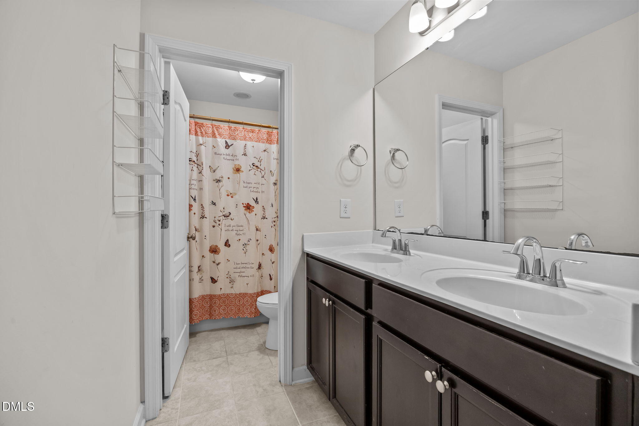 3409 South Beaver Lane Raleigh, NC 27604 - Photo 24 of 31 a bathroom with a double vanity sink toilet and shower