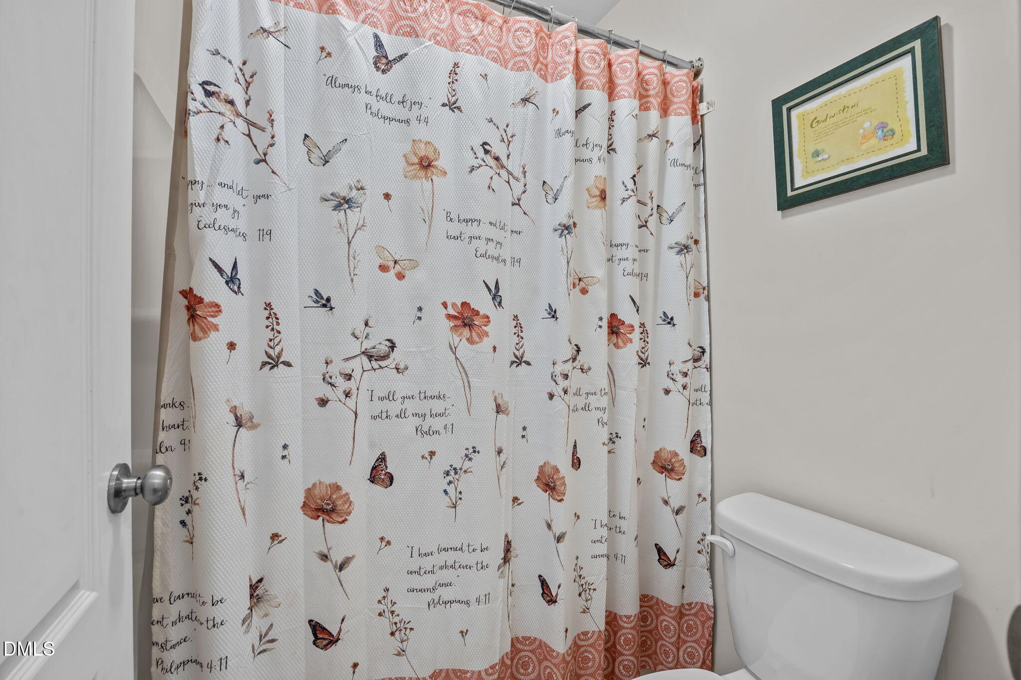 3409 South Beaver Lane Raleigh, NC 27604 - Photo 25 of 31 a white toilet sitting next to a shower curtain